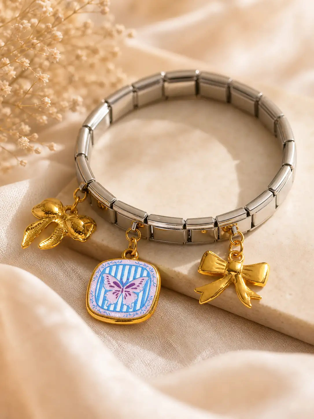 Lazo Pop – Pulsera en acero elástica con charms